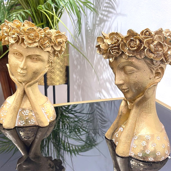 2 décorations dorées têtes humaines avec couronnes de fleurs  Rf-182378